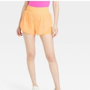 NWT all in motion orange translucent tulip sport shorts size L.